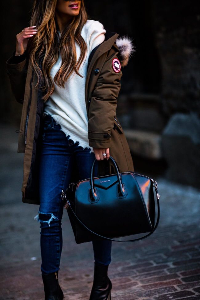 fashion blogger mia mia mine wearing a givenchy bag and a white distressed sweater from elevtd