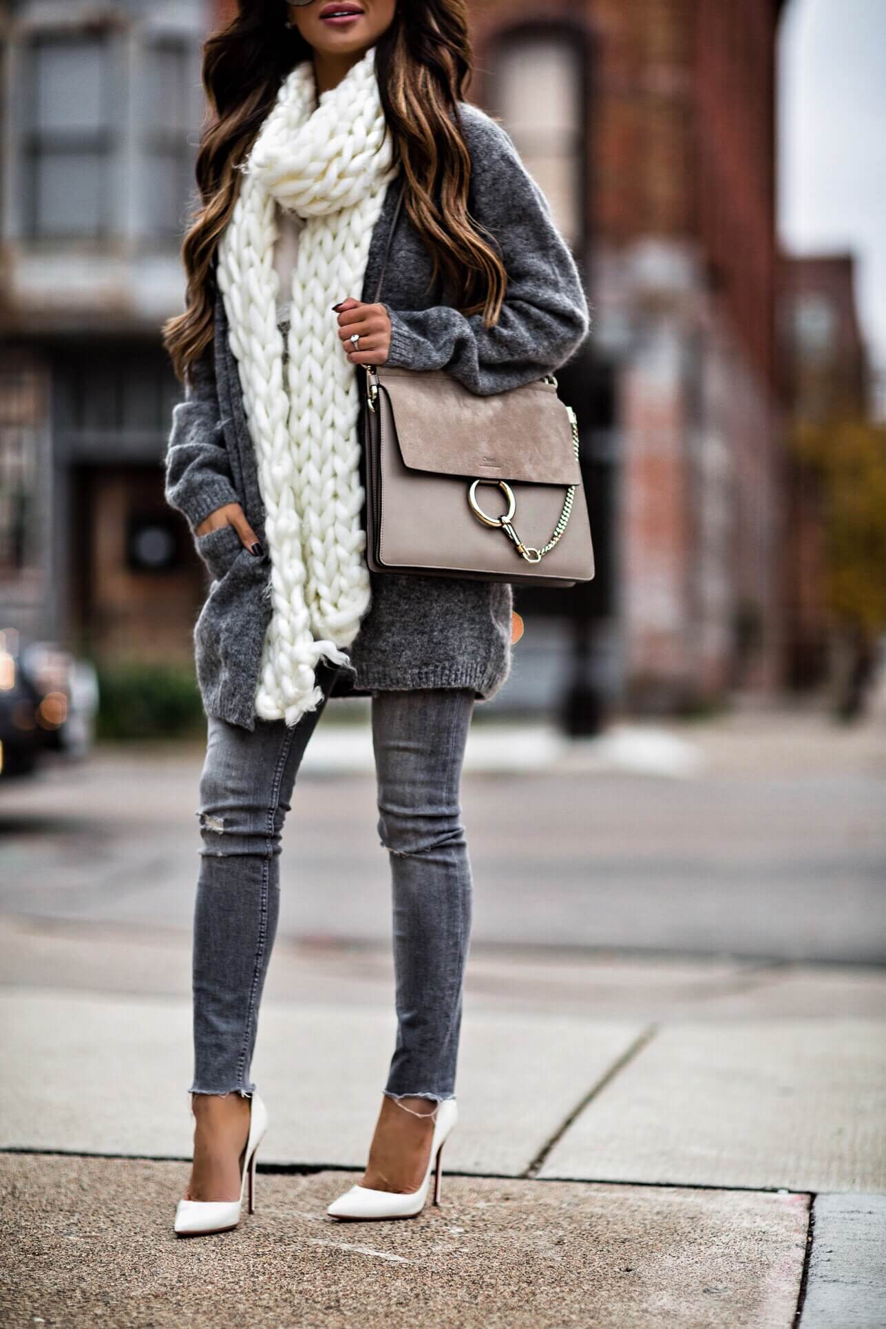 mia mia mine wearing a chunky knit scarf and chloe faye bag