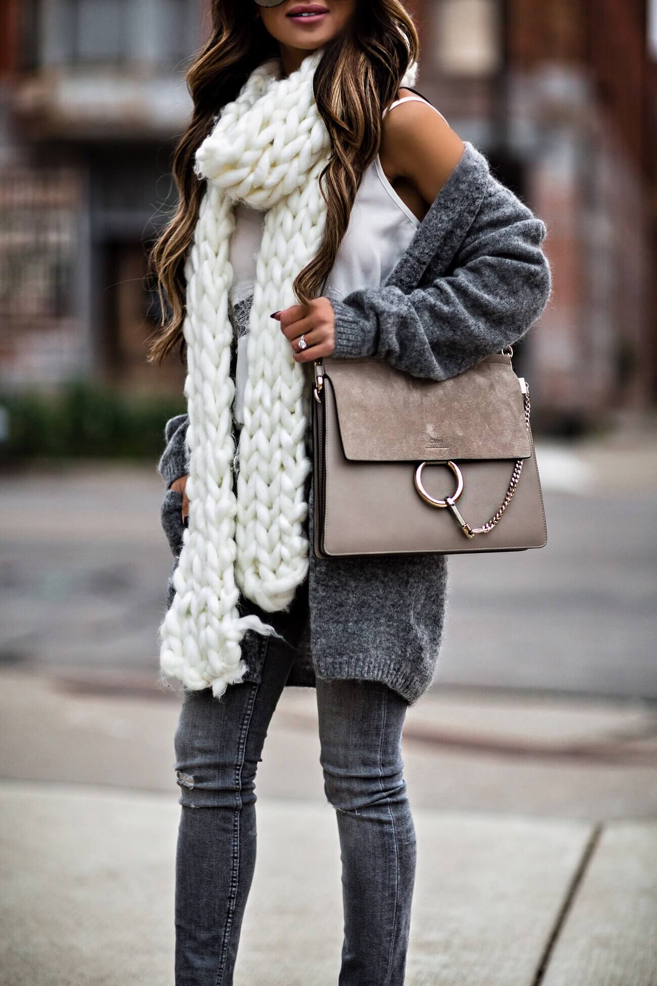 fashion blogger mia mia mine wearing a chunky knit scarf and chloe faye bag from nordstrom