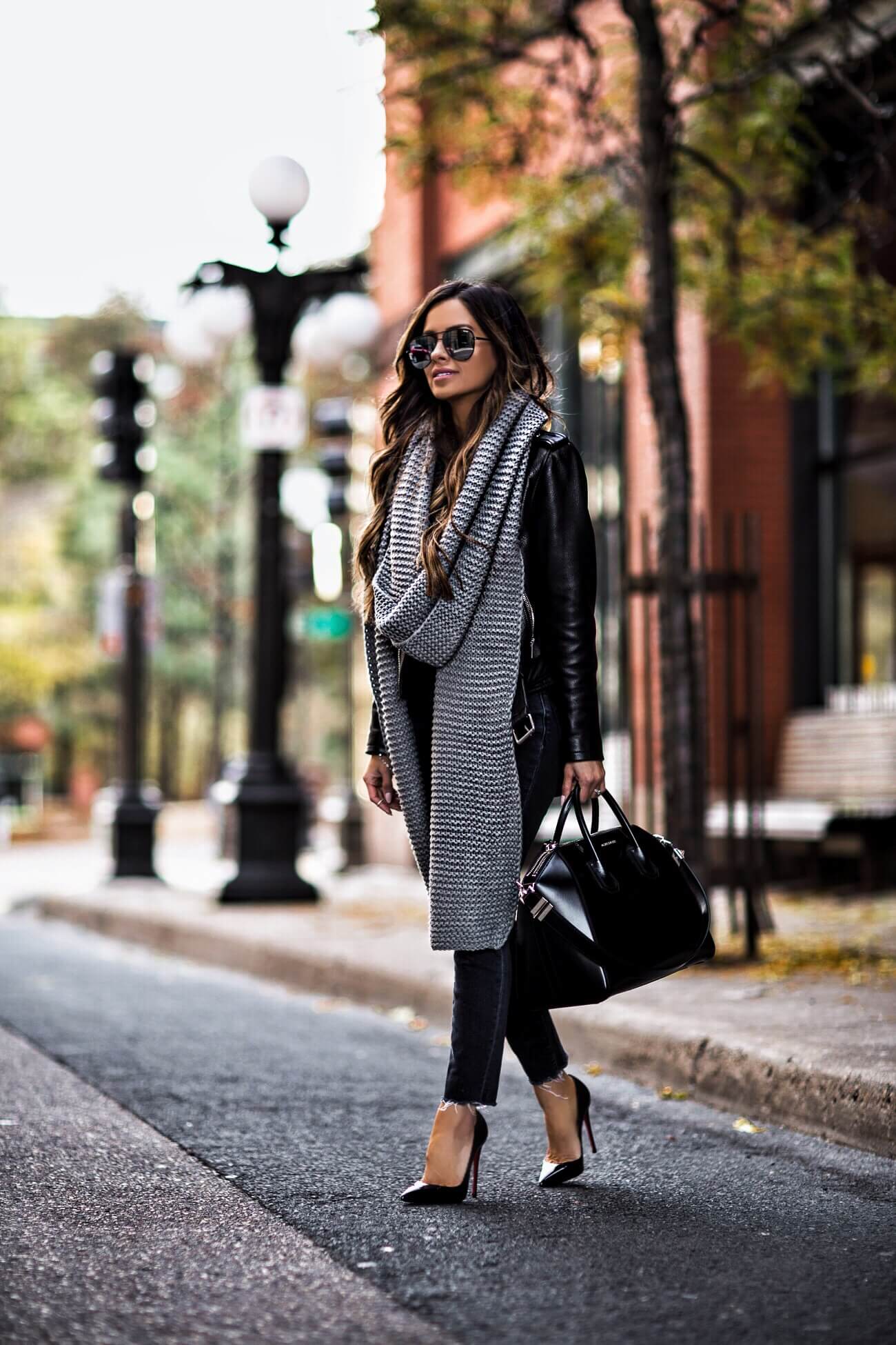 fashion blogger mia mia mine wearing a leather jacket and givenchy antigona bag