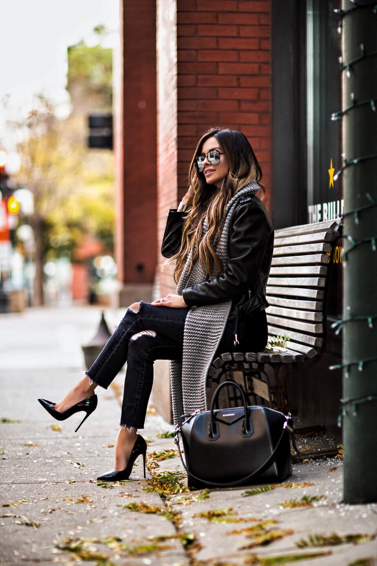 fashion blogger mia mia mine wearing a gray scarf and a leather jacket