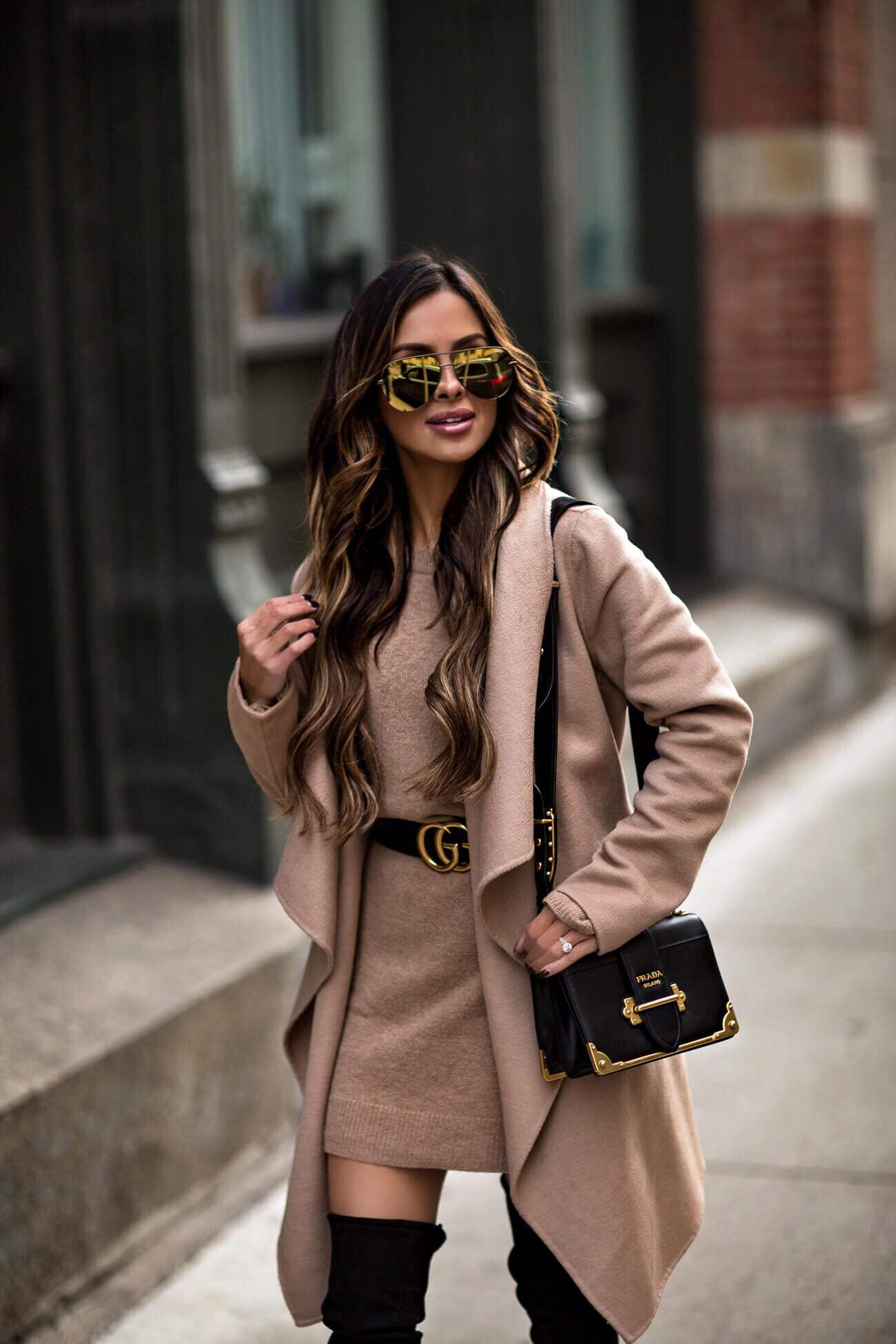 mia mia mine wearing a prada cahier bag and a gucci belt