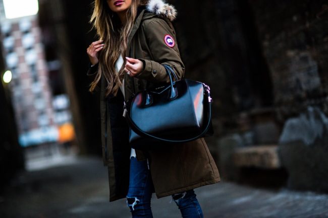 fashion blogger mia mia mine wearing a givenchy antigona bag and a canada goose jacket