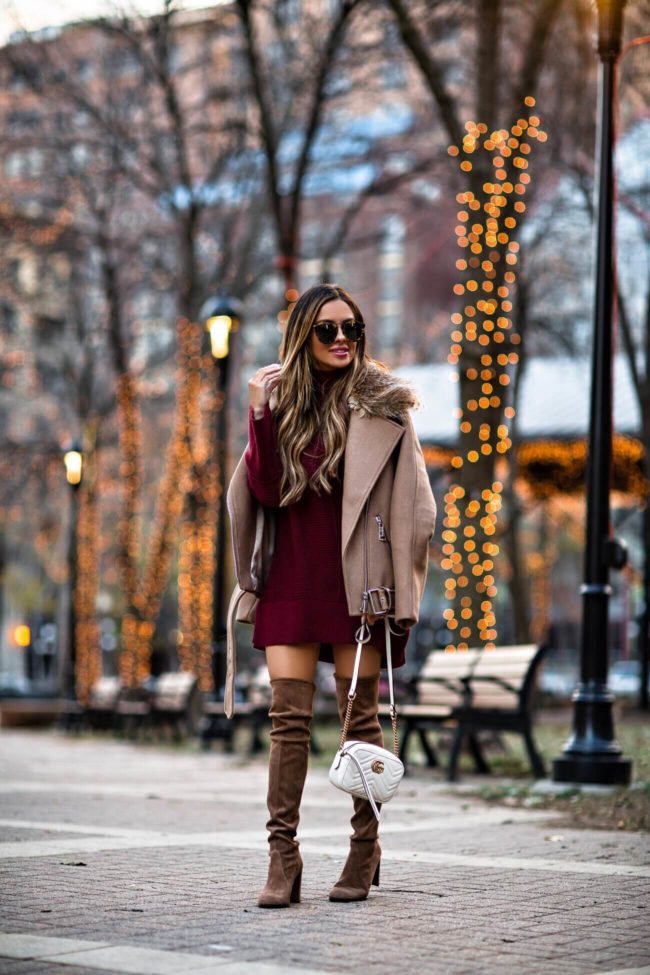 mia mia mine wearing a camel biker jacket and brown suede stuart weitzman over the knee boots
