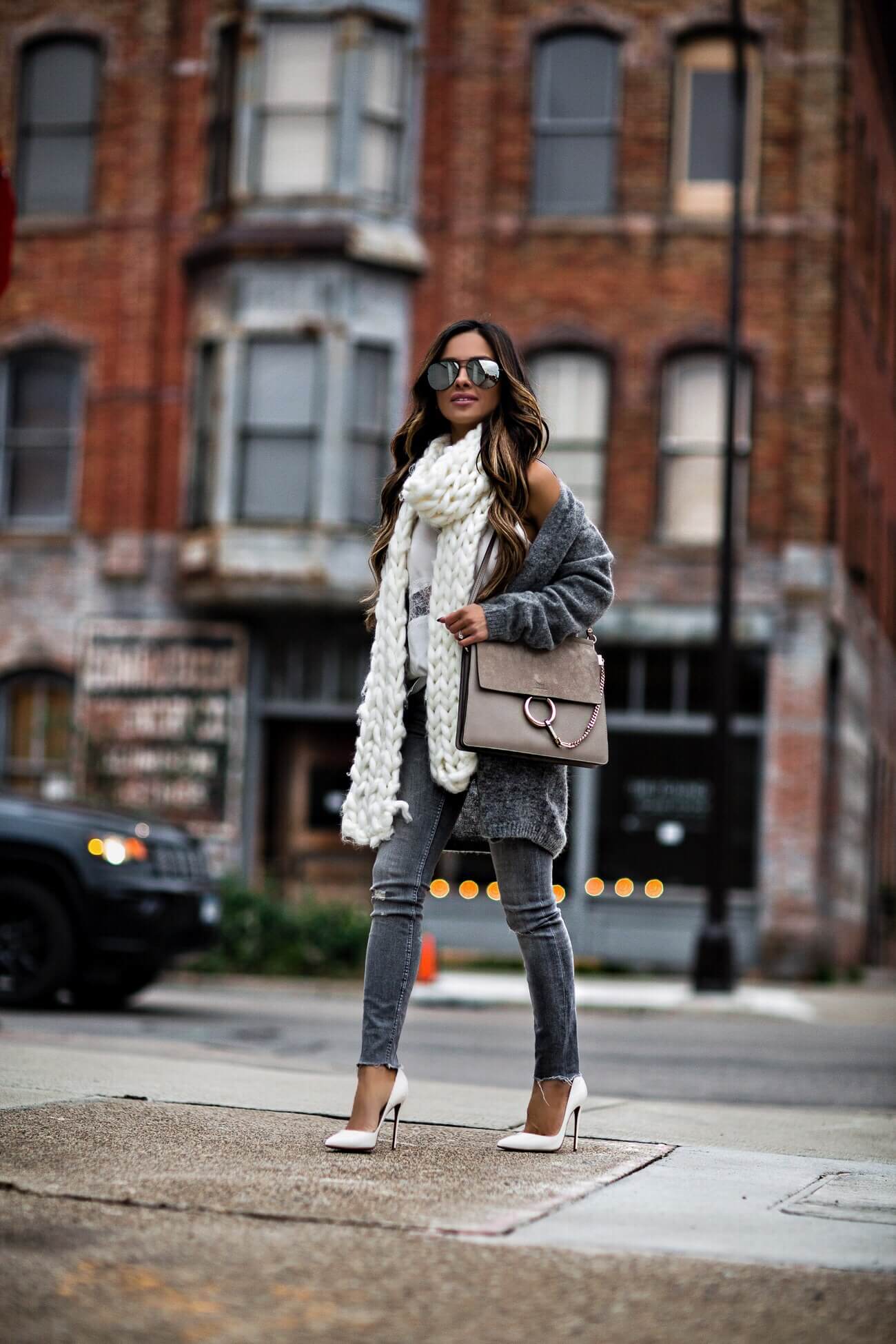 mia mia mine wearing white christian louboutin heels and a chloe faye bag