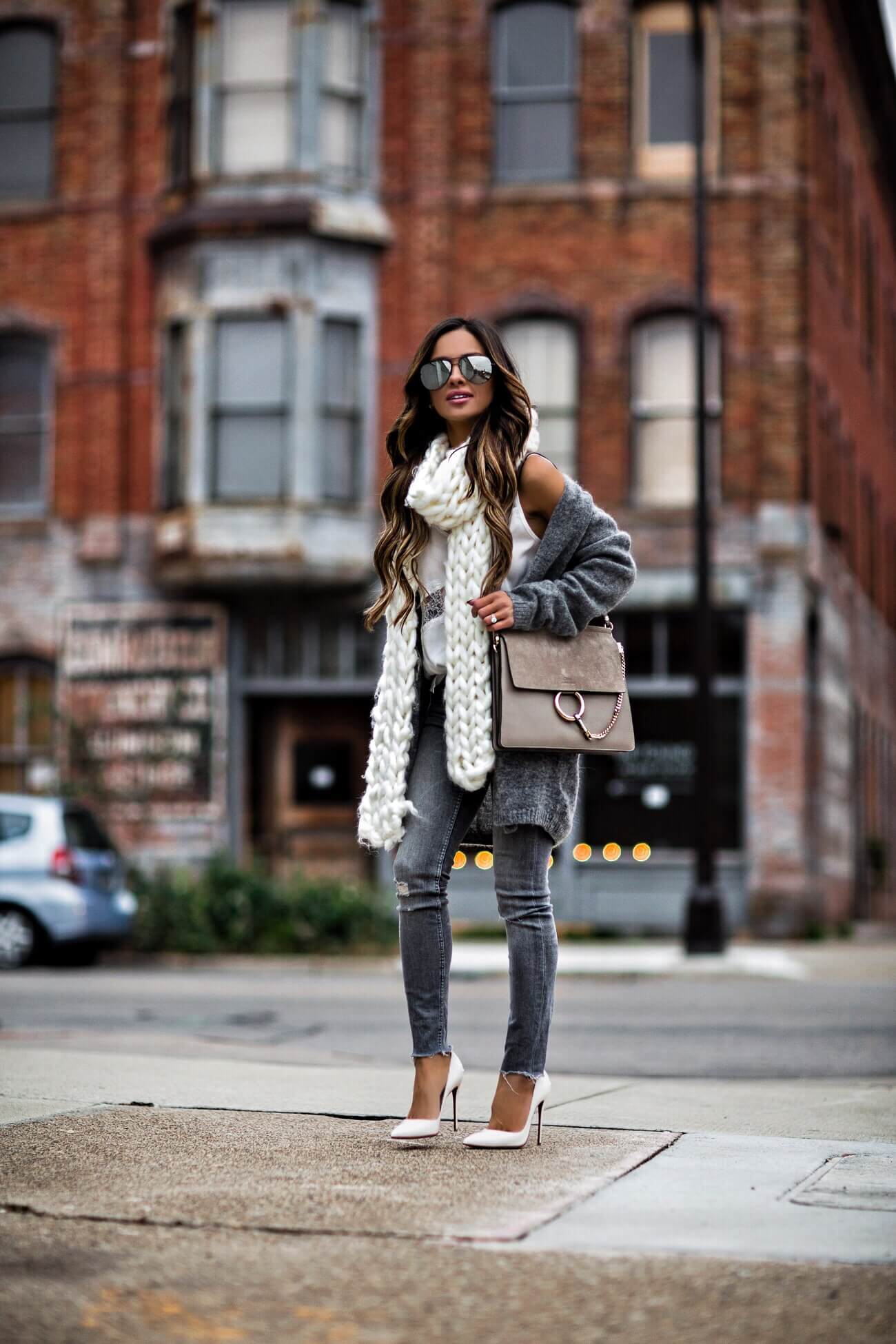 fashion blogger mia mia mine wearing a chloe faye bag and christian louboutin white heels from saks