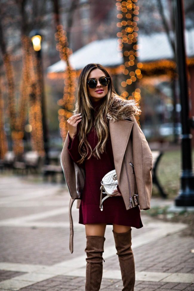 fashion blogger mia mia mine wearing a camel biker jacket and a burgundy sweater dress from nordstrom