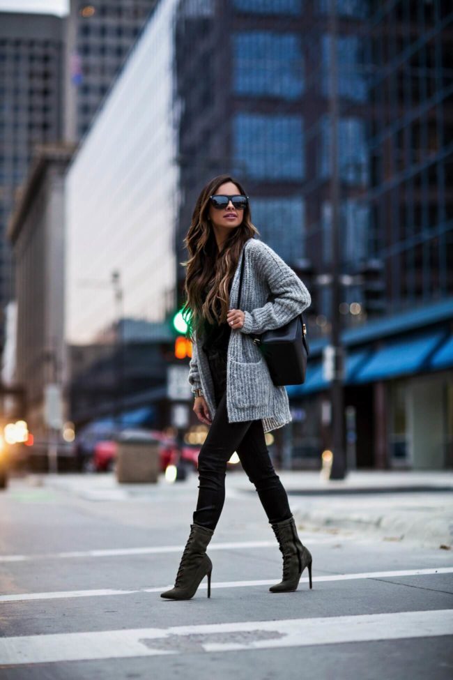 mia mia mine wearing steve madden booties and a gray free people cardigan from macy's