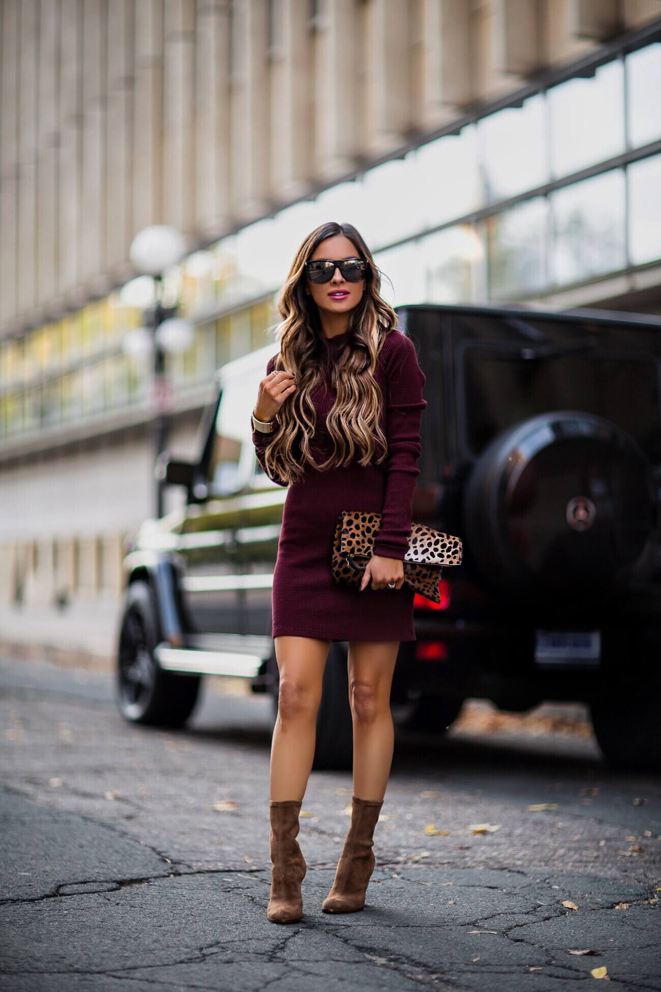 fashion blogger mia mia mine wearing a burgundy dress from intermix and a leopard clutch 