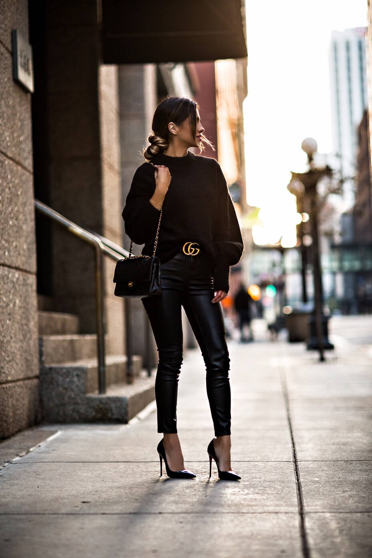 fashion blogger mia mia mine wearing an h&m black sweater and leather leggings