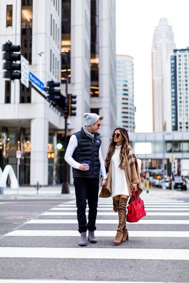 fashion blogger mia mia mine wearing a burberry cape with husband 