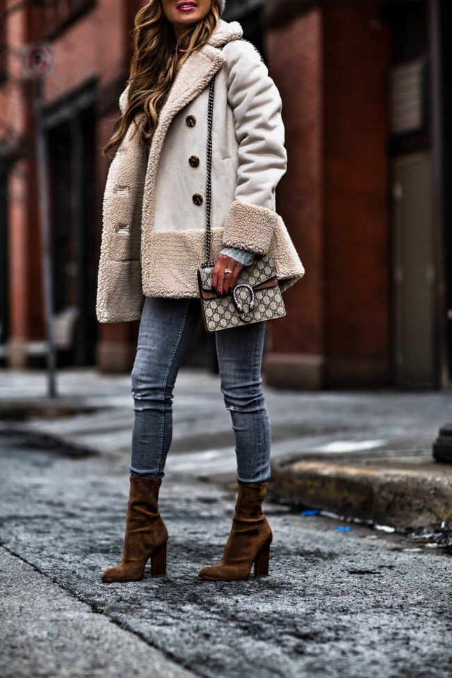 fashion blogger mia mia mine wearing a mother shearling jacket from bloomingdales