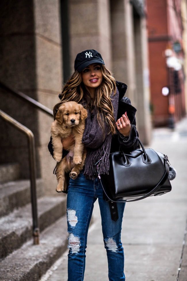 fashion blogger mia mia mine wearing a givenchy antigona bag and a ny baseball cap