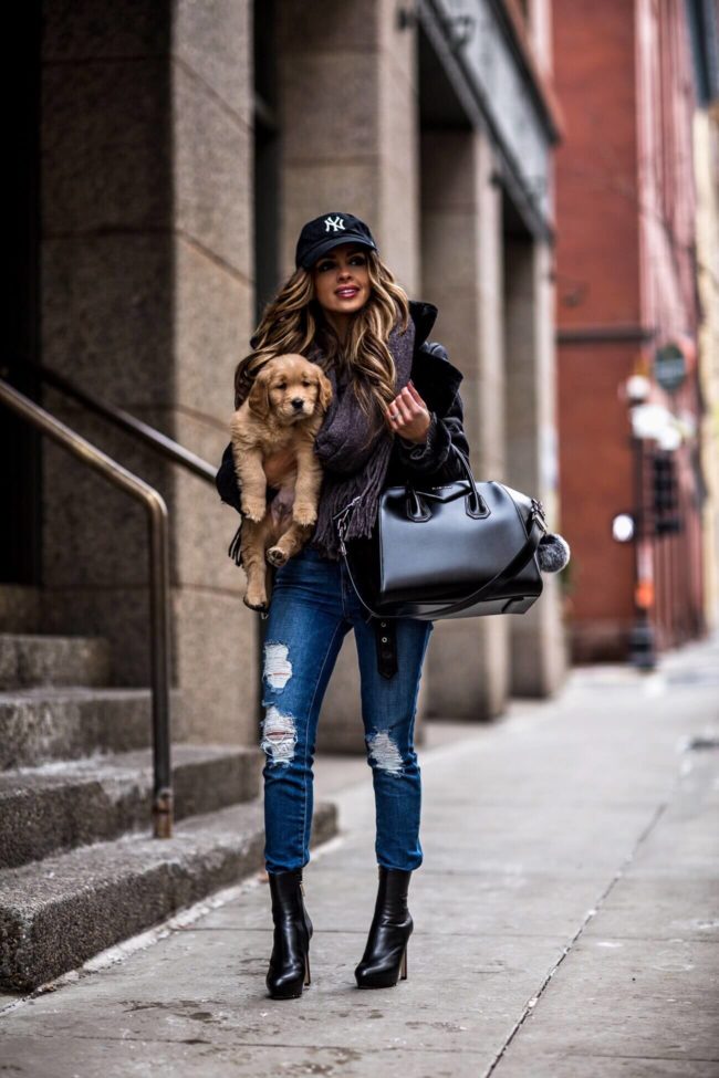 fashion blogger mia mia mine wearing a givenchy antigona bag with golden retriever puppy