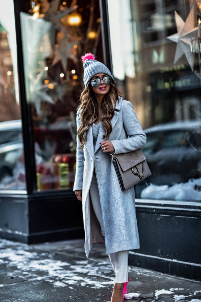 fashion blogger mia mia mine wearing a gray club monaco coat and pink kurt geiger heels