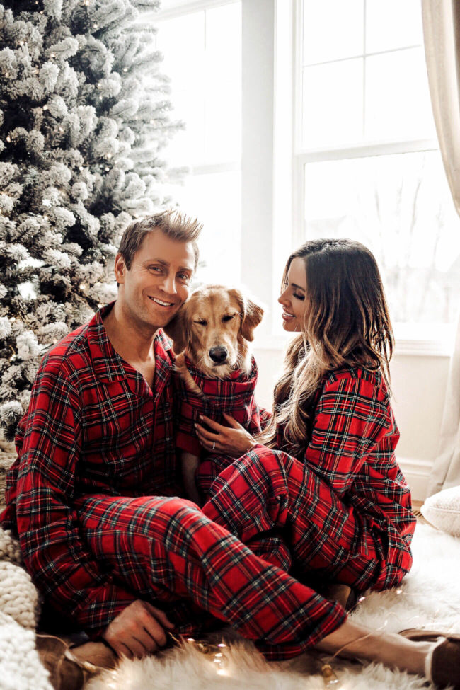fashion blogger mia mia mine wearing christmas pajamas from macy's with husband and dog