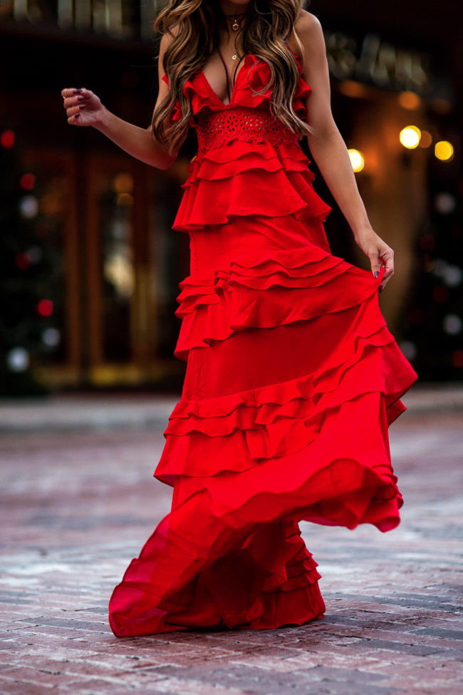fashion blogger mia mia mine wearing a red lace tiered dress