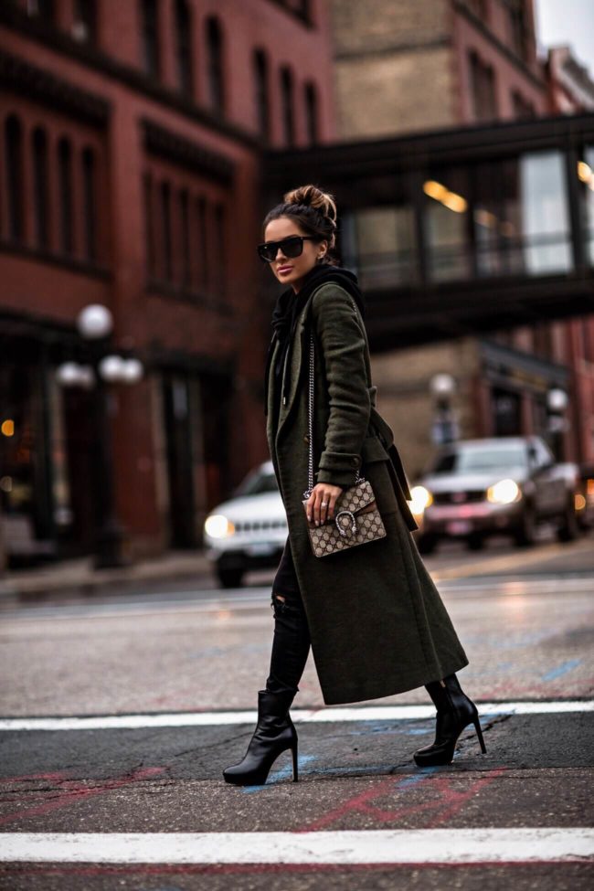 fashion blogger mia mia mine wearing a green trench coat from asos