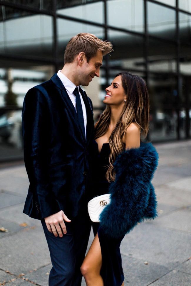 fashion blogger mia mia mine wearing a new year's eve dress with husband phil thompson