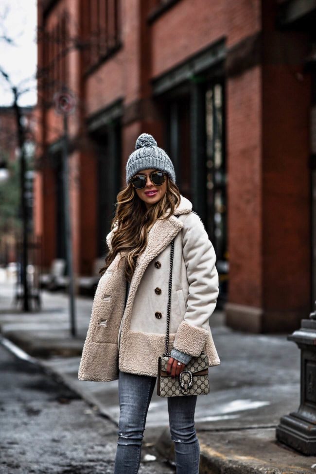 fashion blogger mia mia mine wearing a sherpa jacket by mother and a gucci dionysus bag