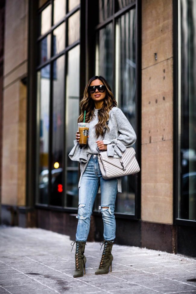 fashion blogger mia mia mine wearing a saint laurent college bag and steve madden green lace-up booties