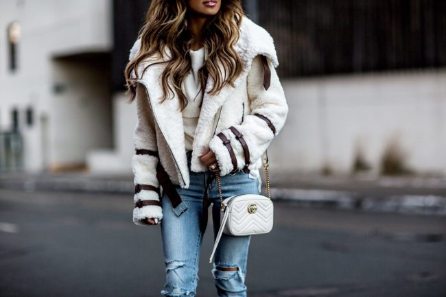 fashion blogger mia mia mine wearing an eaves moto jacket from revolve and a gucci marmont mini white mini bag