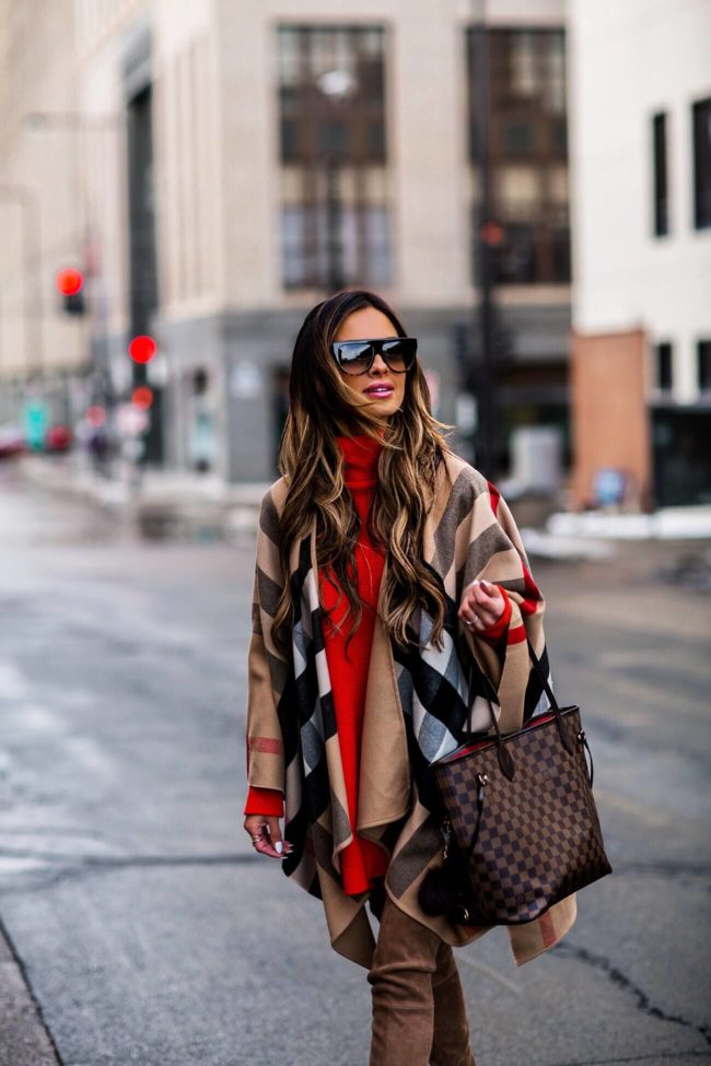 fashion blogger mia mia mine wearing a burberry cape and louis vuitton neverfull