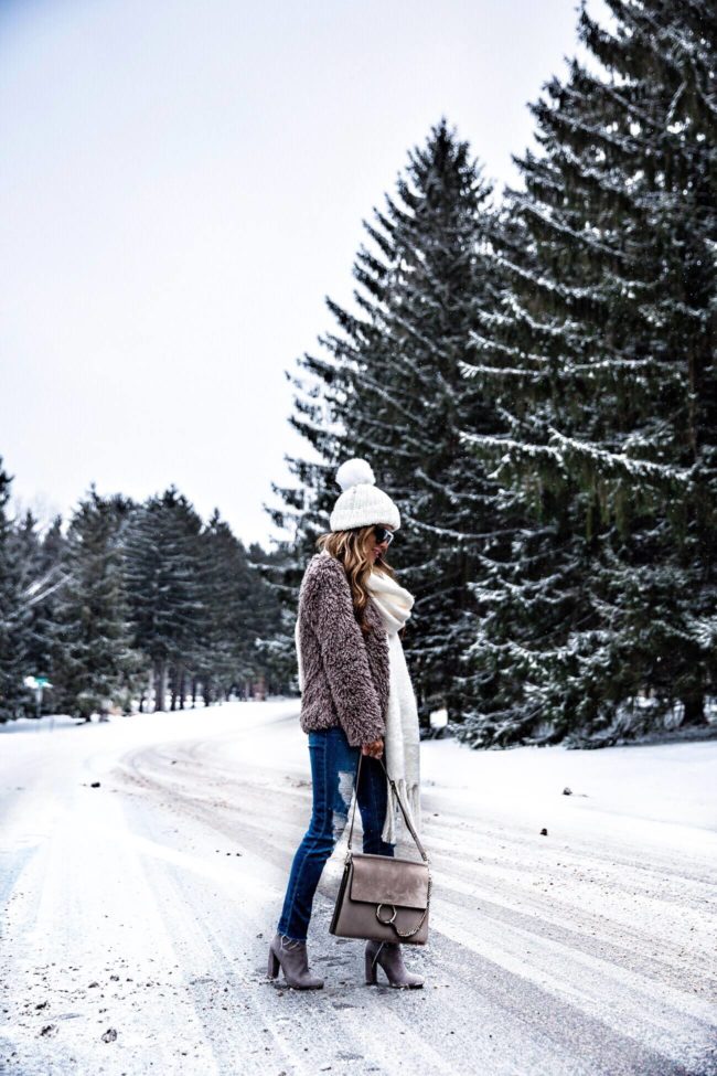 fashion blogger mia mia mine wearing a free people hat and scarf