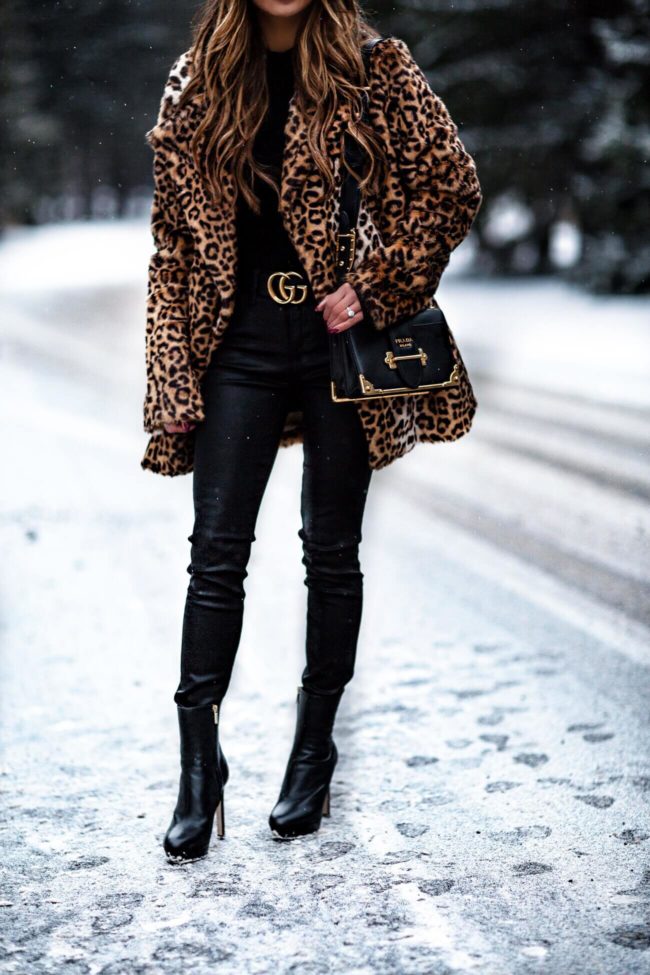 fashion blogger mia mia mine wearing jimmy choo booties and a prada cahier bag