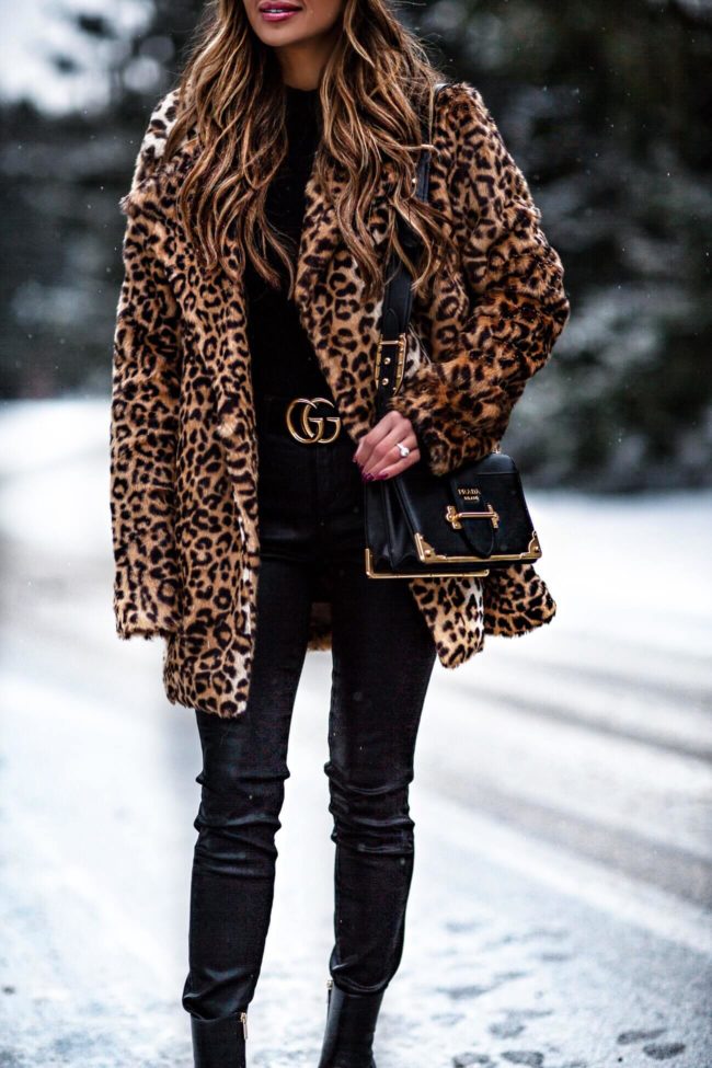 fashion blogger mia mia mine wearing a prada cahier bag and a gucci belt