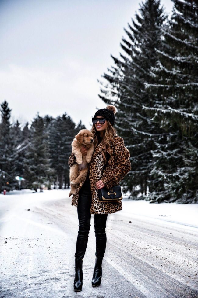 mia mia mine wearing a leopard coat and prada cahier bag