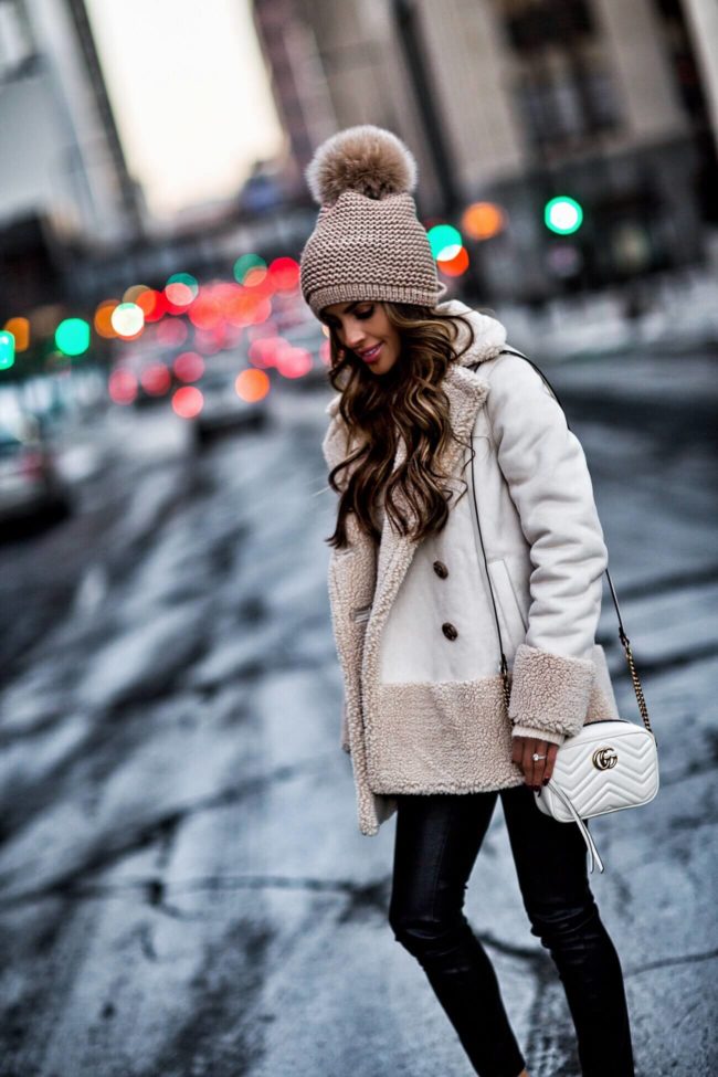 mia mia mine wearing a pom pom beanie from bloomingdale's