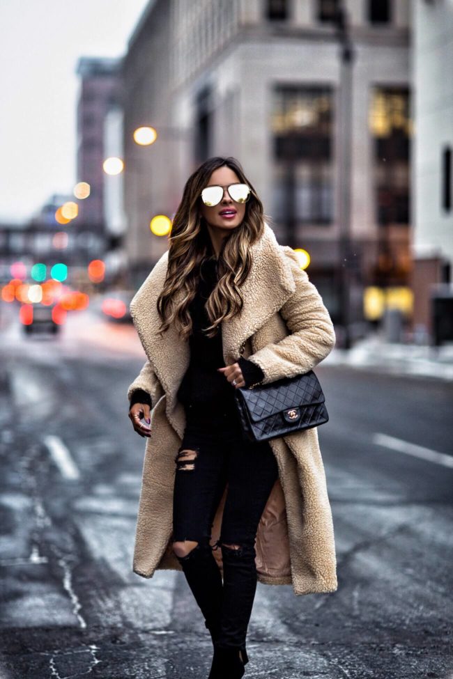 fashion blogger mia mia mine wearing a teddy bear coat from missugided with a chanel 2.55 bag