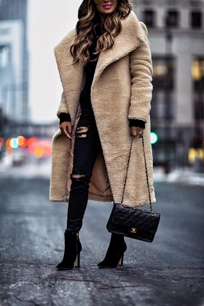 fashion blogger mia mia mine wearing a beige teddy bear coat from missguided and a chanel bag
