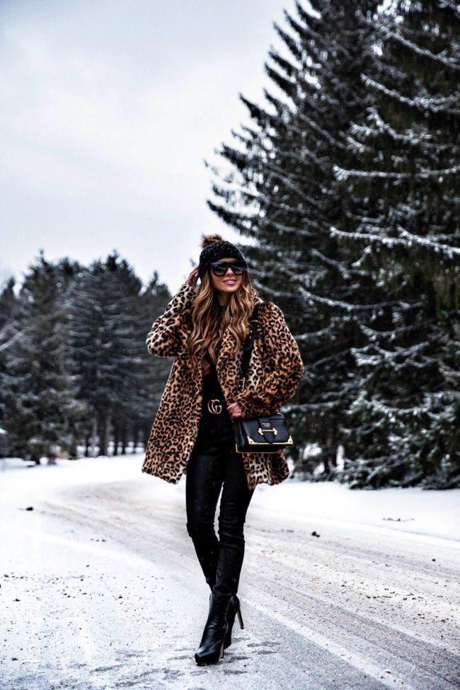 fashion blogger mia mia mine wearing a leopard coat from nordstrom and a prada cahier bag