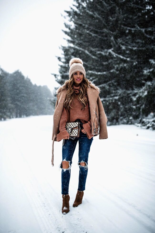 fashion blogger mia mia mine wearing a camel coat from H&M and a gucci dionysus bag