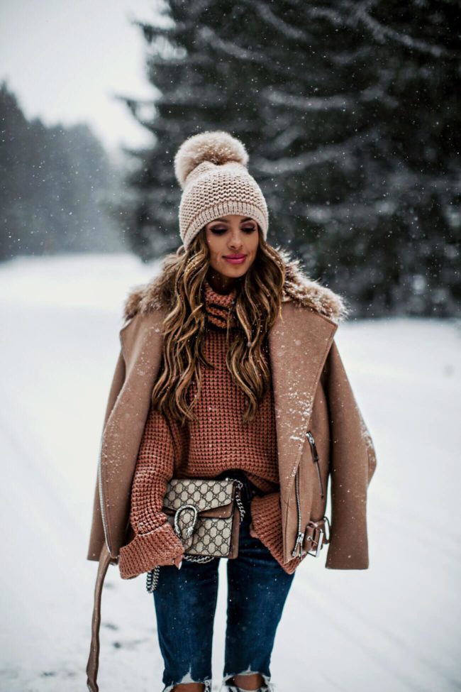 mia mia mine wearing a pom pom beanie hat from bloomingdale's