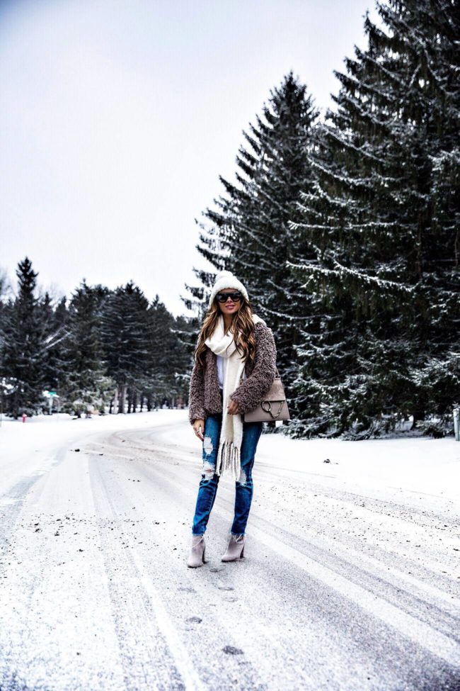 fashion blogger mia mia mine wearing a free people hat and free people scarf