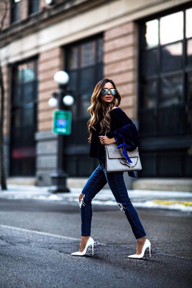 fashion blogger mia mia mine wearing a chloe faye bag and blue velvet top and chloe faye bag from nordstrom