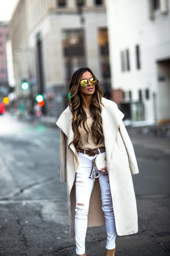 fashion blogger mia mia mine wearing an ivory waterfall jacket and a gucci belt