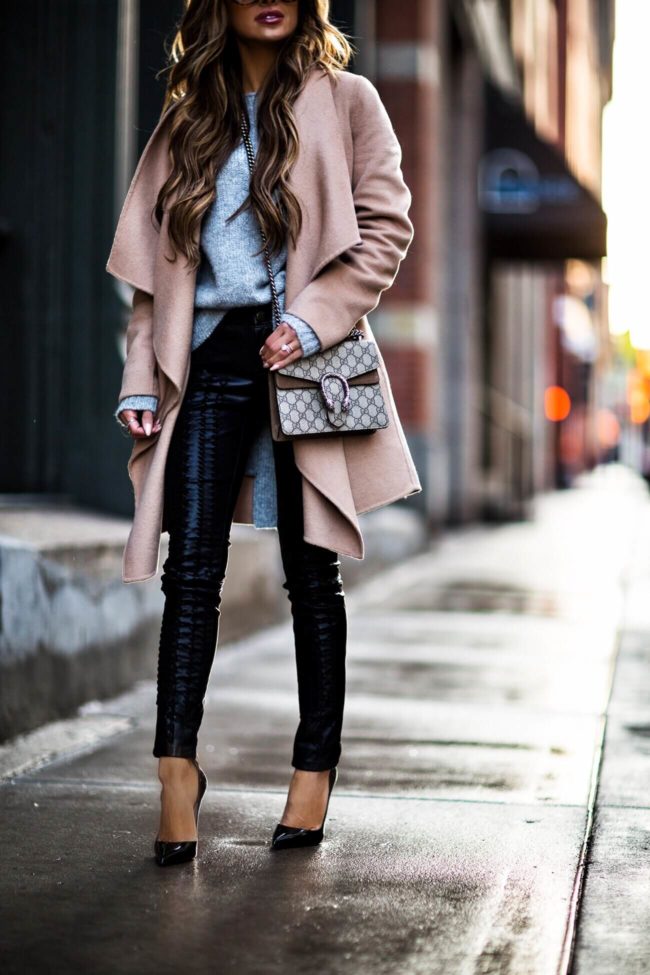 mia mia mine wearing black lace-up black leather pants and a camel coat from nordstrom