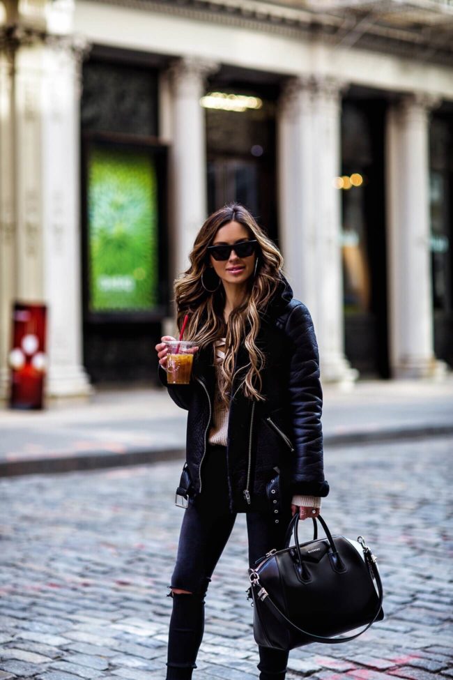 fashion blogger mia mia mine wearing an H&M black jacket and givenchy antigona bag