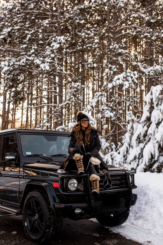 fashion blogger mia mia mine in a forest in the winter