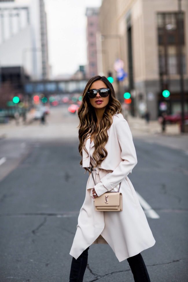 fashion blogger mia mia mine wearing a trench coat from nordstrom and a saint laurent sunset bag