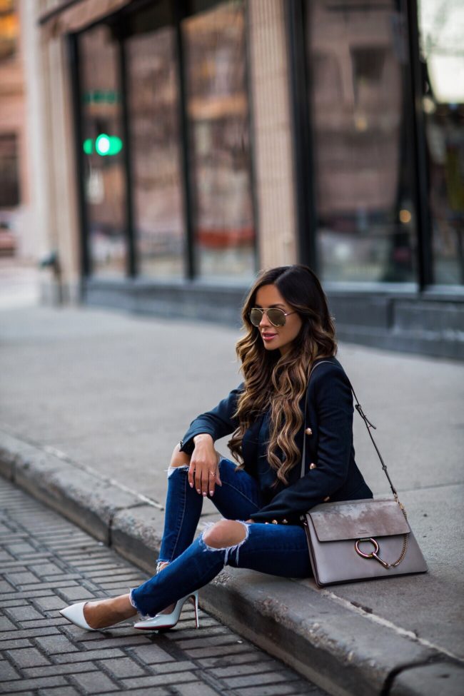 fashion blogger mia mia mine wearing a navy blazer and a chloe faye medium bag