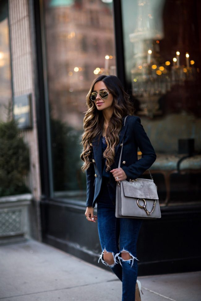 fashion blogger mia mia mine wearing a lioness navy blazer and a chloe faye bag