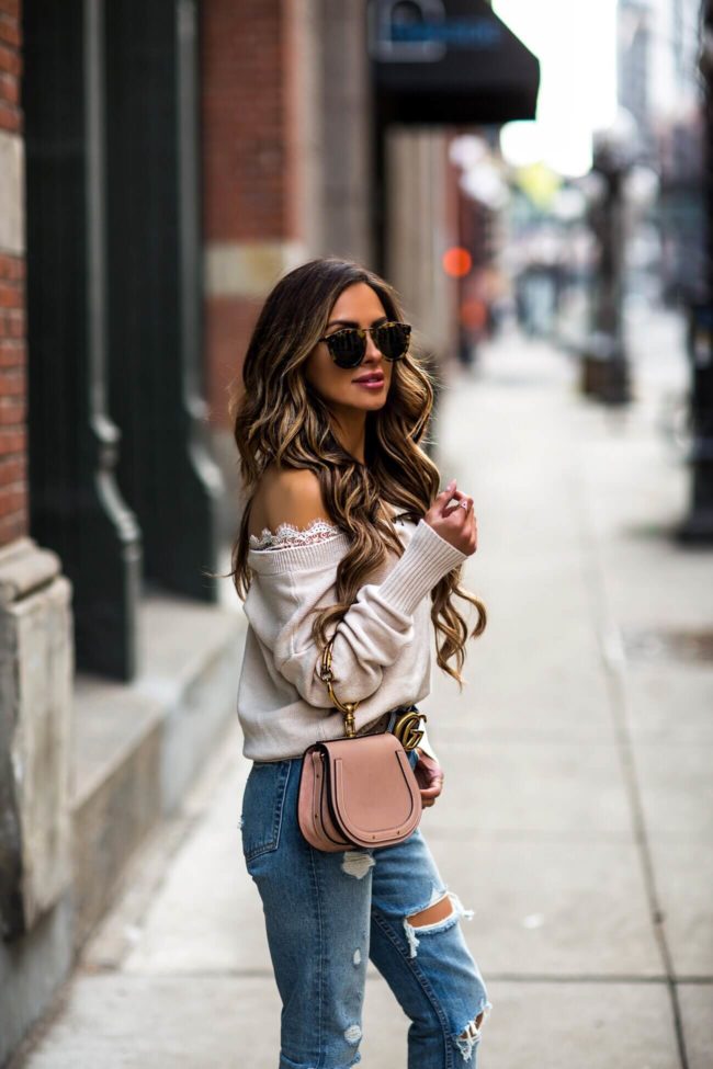 fashion blogger mia mia mine wearing a lace trim sweater from H&M and a chloe nile bag