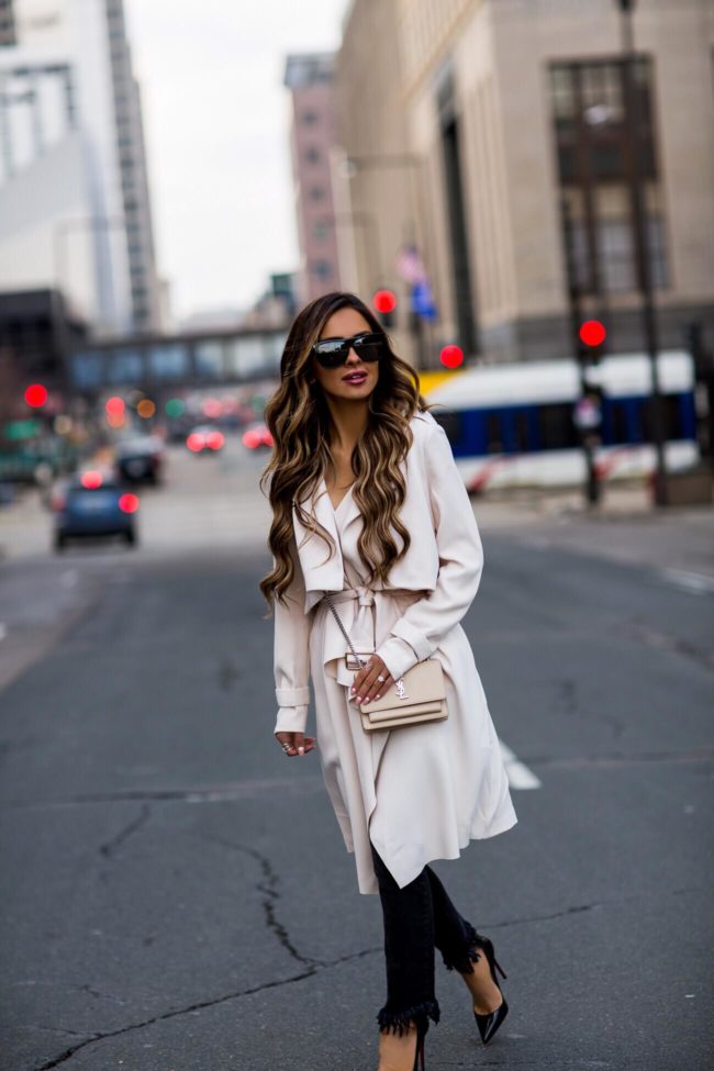 fashion blogger mia mia mine wearing an ivory trench coat from nordstrom and a saint laurent sunset bag