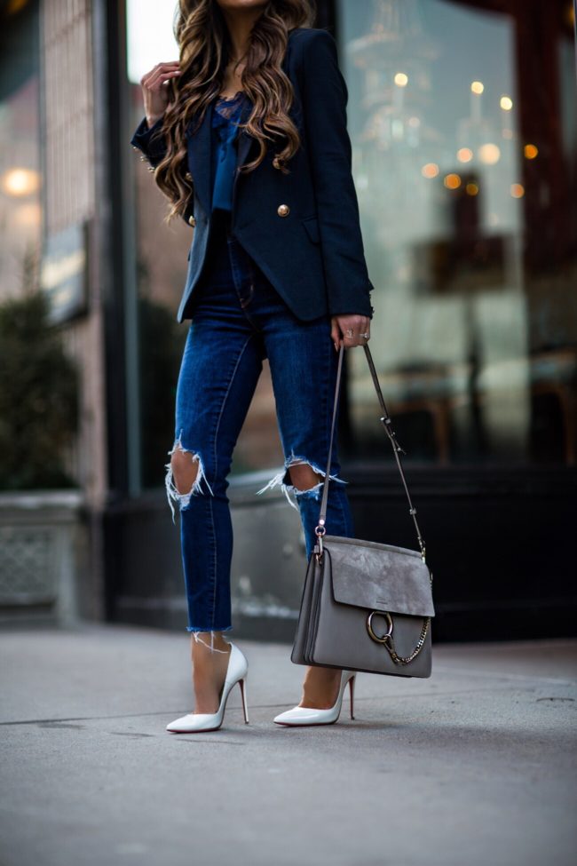 fashion blogger mia mia mine wearing white christian louboutin heels and levi's denim