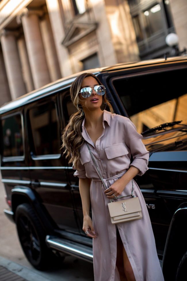fashion blogger mia mia mine wearing a beige saint laurent mini crossbody bag
